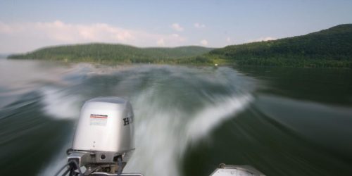 speeding-boat-engine-on-a-serene-lake